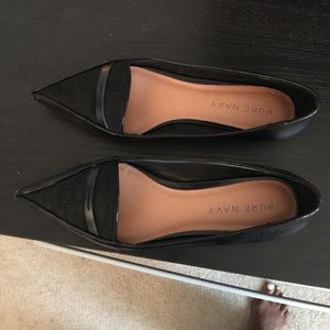 Black leather pointed toe flats with calf hair