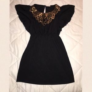 Black dress with gold detailing •