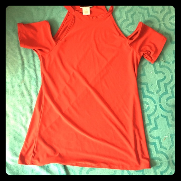 Orange shirt off the shoulders