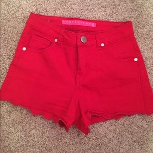 Red high-waisted shorts.