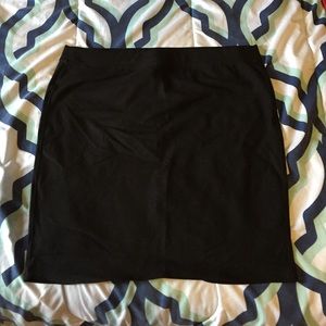 Simple black knee length skirt