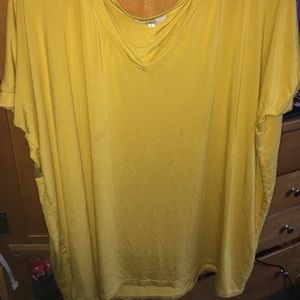 Short sleeved v-neck mustard colored Piko top