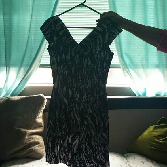 Form fitting  dress. V neck and back.