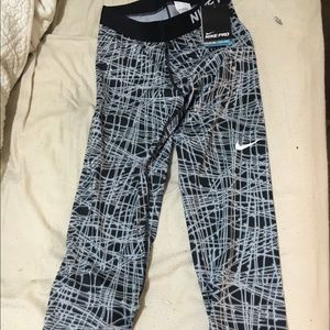 Black and grey Nike pros