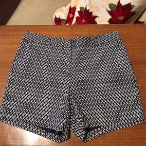 Patterned Black and White shorts.
