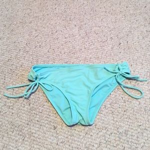 Aqua colored bikini bottoms.