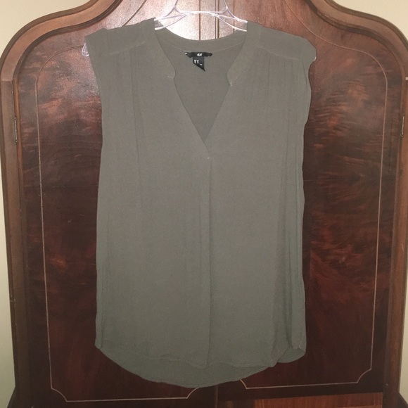 Olive green sleeveless blouse.