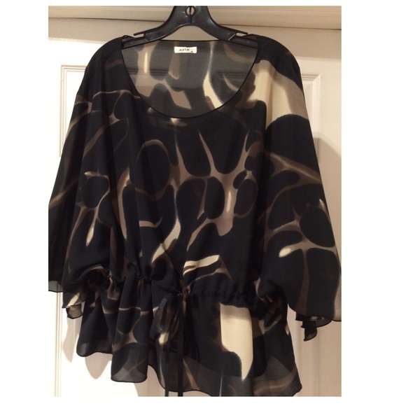 Sheer puncho style top / adjustable belt.