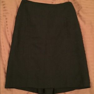 Beautiful black skirt with buttons in the back.