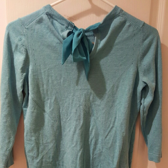 Light blue sweater with tie back neck