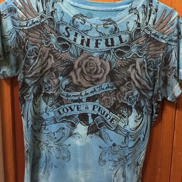 Sinful blue roses and wings love and pride