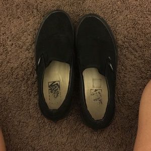 All black slip on vans