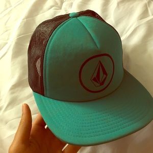 Turquoise and black hat