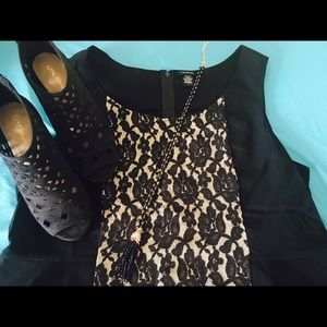 Black quasi-peplum top with lace