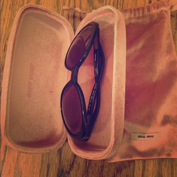 Black miu miu sunglasses.