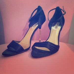 Black stilettos with gold heel