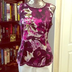Purple flower patterned sleeveless blouse.
