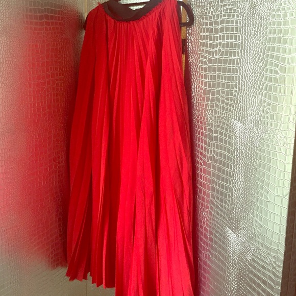 Red pleated maxi skirt
