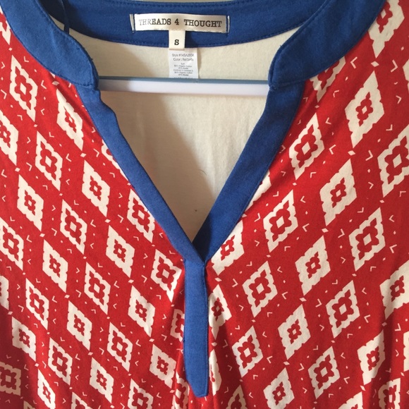 Red and white patterned top with blue trim. - Picture 2 of 3