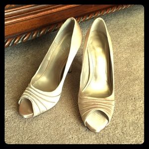 Gold peep-toe satin heels