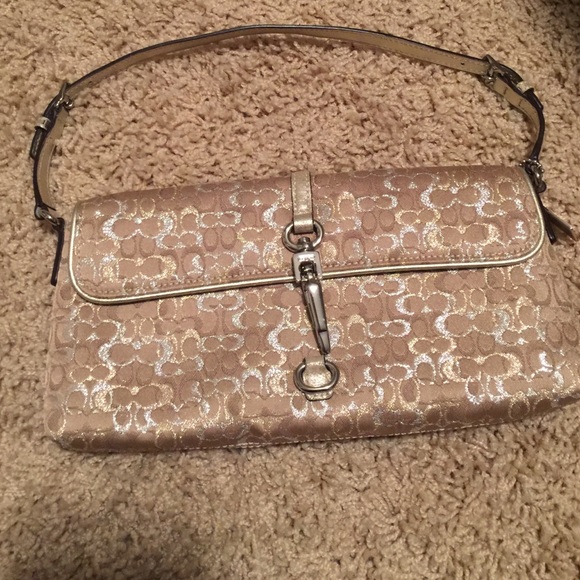 Champagne color Coach wristlet