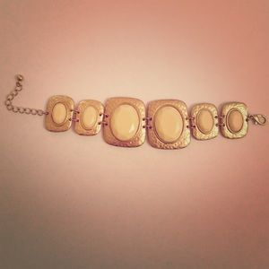 Gold plated link bracelet with ivory stones