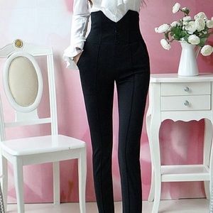 Slim fit high waisted dress pants.