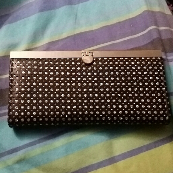 Black with silver hardware and specks.