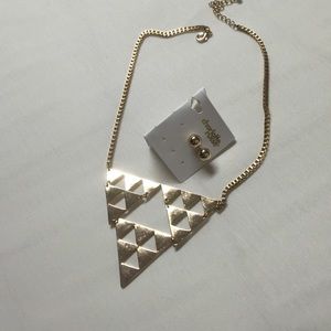 Gold earrings with a gold necklace.