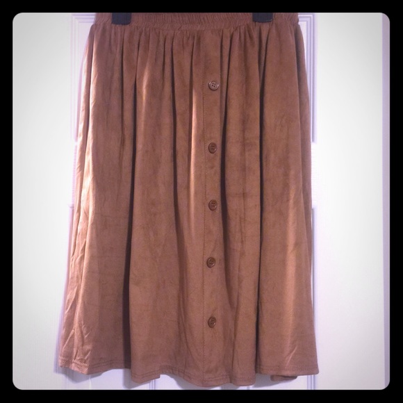 Tan suede skirt! Buttons down the middle.
