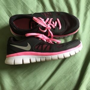 Pink and black nike shoes
