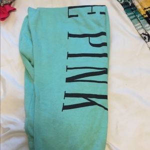 pink pull over and sweats