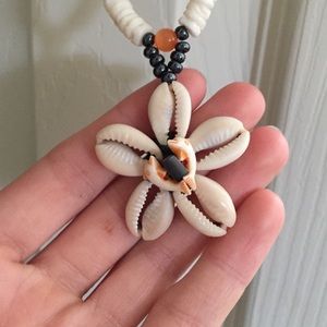 Shell necklace with dolphins