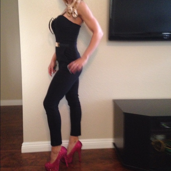 Black one piece Jump suit with gold accent on belt