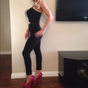 Black one piece Jump suit with gold accent on belt