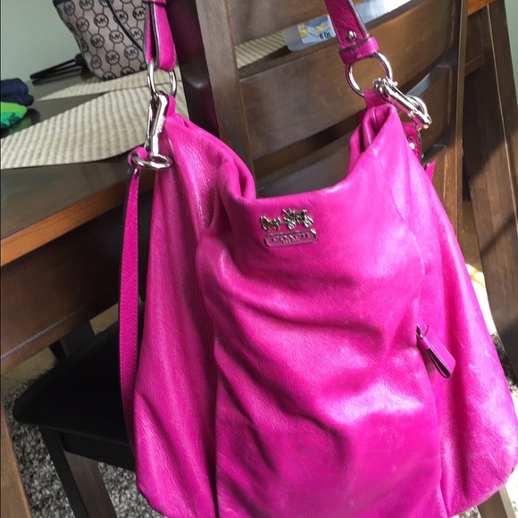 Auth Coach hand bag with shoulder strap.