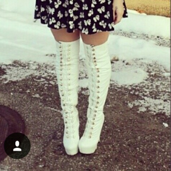 Thigh high white boots.