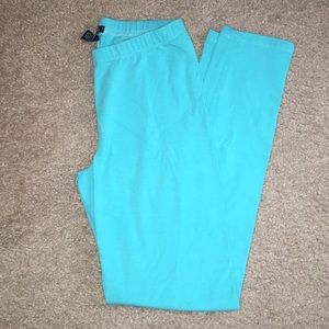 Turquoise leggings.