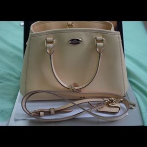 Coach bag in peach color.