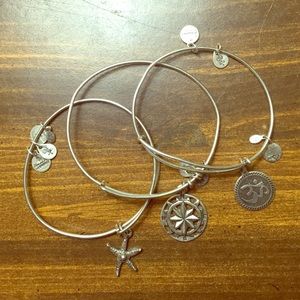 Three Alex & Ani bracelets