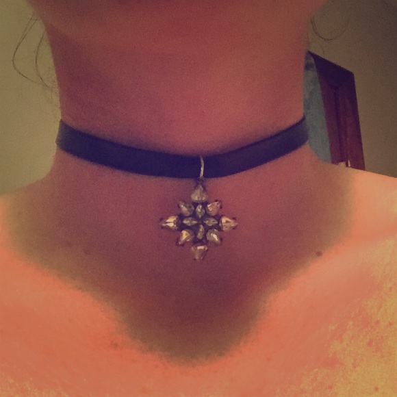 Starburst pendant and leather choker.