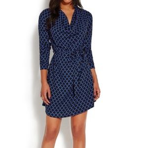 Cowl neck dress with flattering waist tie.