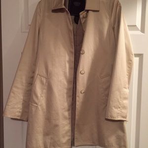 A khaki Coach trench coat