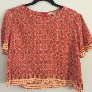 Pink sweater and orange shirt