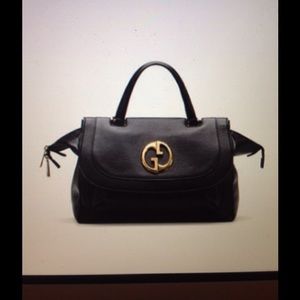 Like new Gucci 1973 top handle bag in black