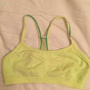 Bright yellow/lime green Ivivva sports bra.