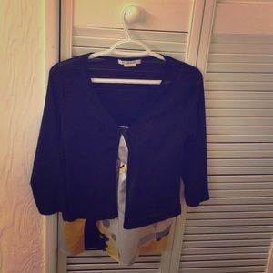 Black polyester overlay with button.