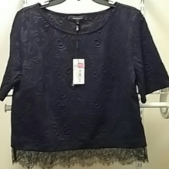 Cute black top with bottom lace trim. Never worn!