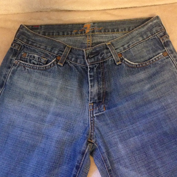 7 For All Man Kind low rise wide leg flare jeans.