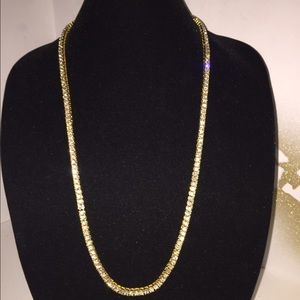 Iced out 14k gold plated, 1 row necklace.